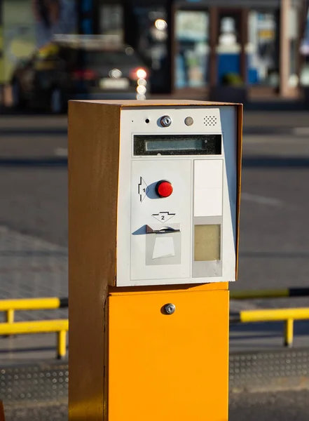 Parking tickets machine on a entree in parking area.