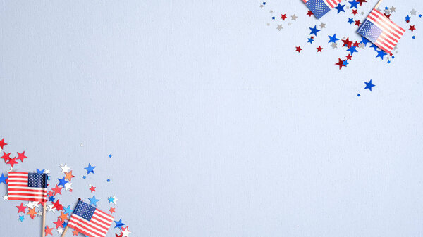 Presidents Day USA, Independence Day, US election concept. American flags and confetti stars on blue background. Flat lay, top view.