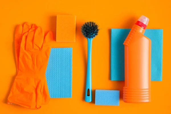 House Cleaning Supplies Collection Orange Background Flat Lay Top View — Stock Photo, Image