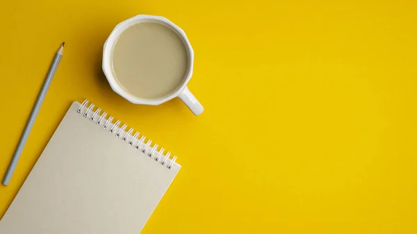 Yellow Office Desk Table Blank Notebook Cup Coffee Pencil Minimal — Stock Photo, Image