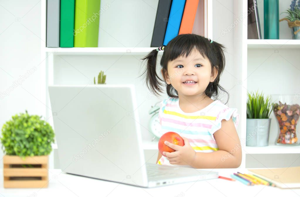 Children using laptop at home