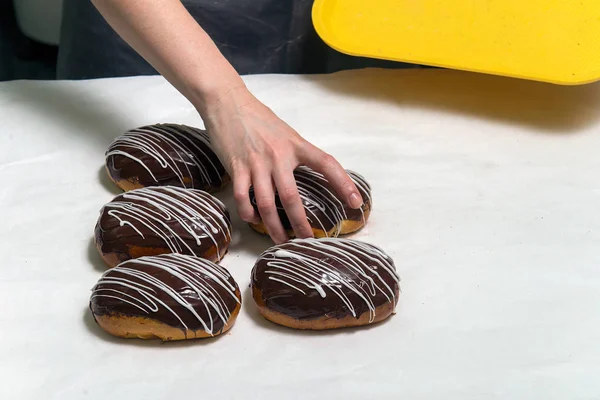 Closeup Female Hands Buns White Baking Sheet — Stock Photo, Image