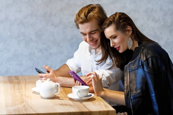 Beautiful Couple Cafe Table Drinks Coffee Watching Something Her Phone — Stock Photo, Image