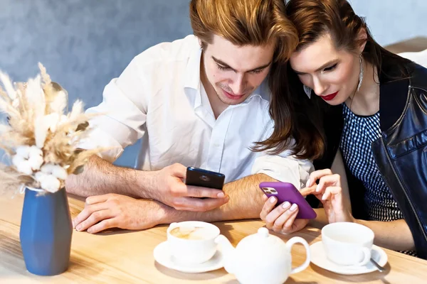 Beautiful Couple Cafe Table Drinks Coffee Watching Something Her Phone — Stock Photo, Image