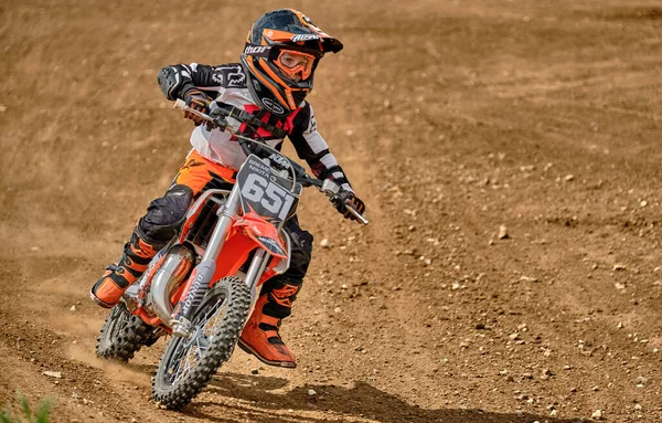 A child at a motocross training session in Moscow at the Technical Sports Stadium 스톡 이미지