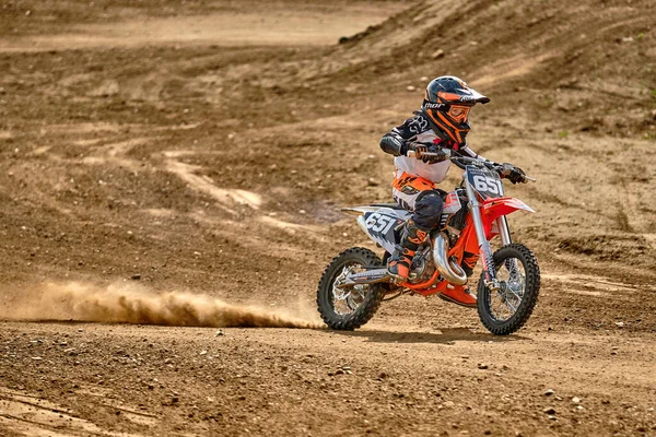 A child at a motocross training session in Moscow at the Technical Sports Stadium 로열티 프리 스톡 이미지