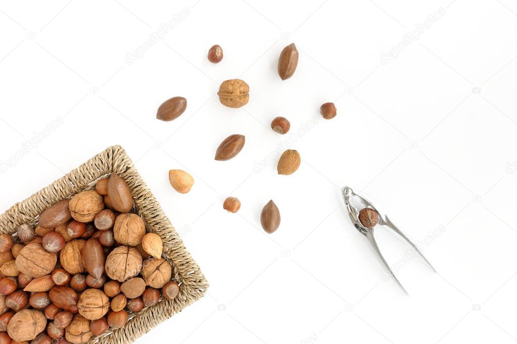 Whole Nuts in Basket, Scattered Nuts and Nutcracker   