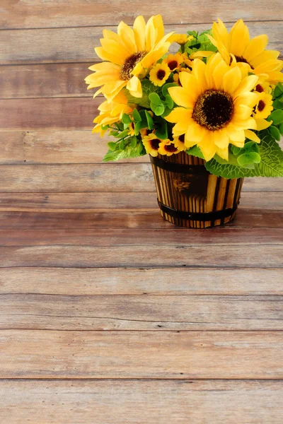 Sunflower Bouquet in Wooden Flowerpot on Wood Background