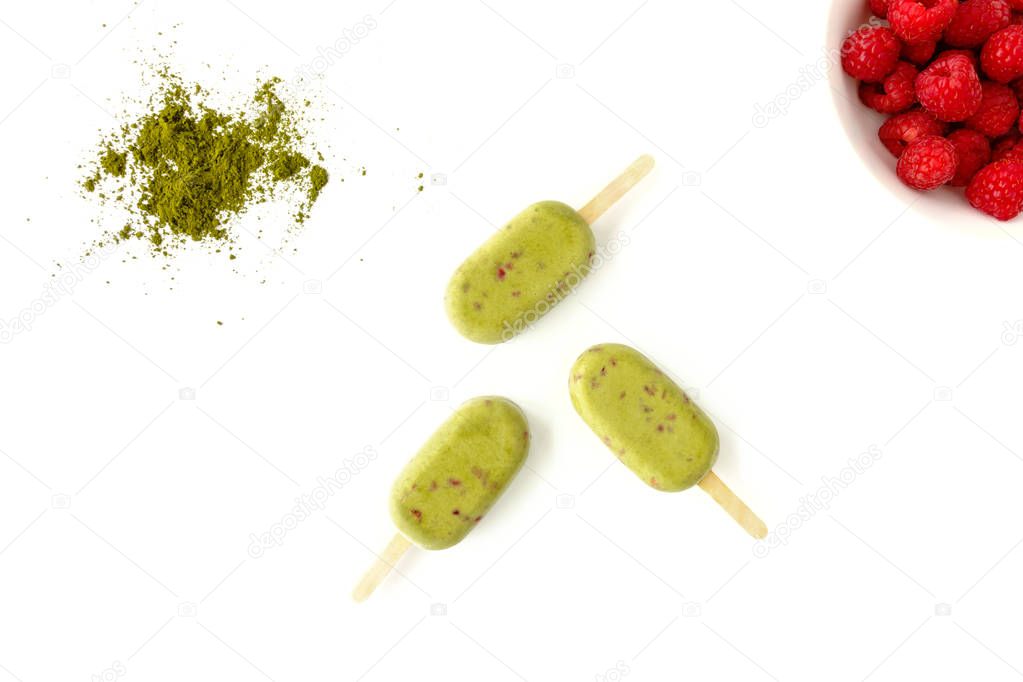 Matcha and Raspberry Popsicles on White Background    
