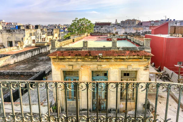 View from the balcony on the roof of old, dilapidated, flaky bui