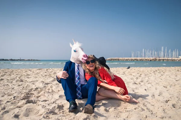 Funny man in elegant suit and comical mask — Stock Photo, Image