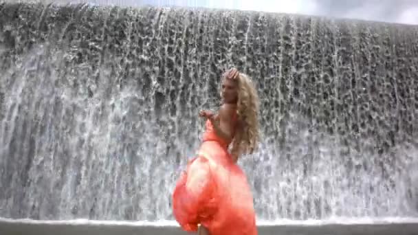 Young Beautiful Woman Orange Dress Posing Background Big Waterfall Girl — Stock Video