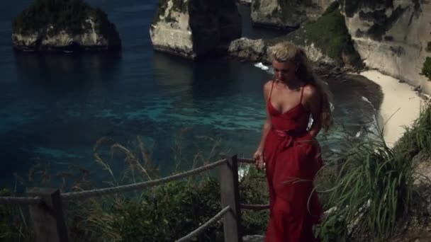 Young Woman Blonde Curly Hair Elegant Long Red Dress Climbs