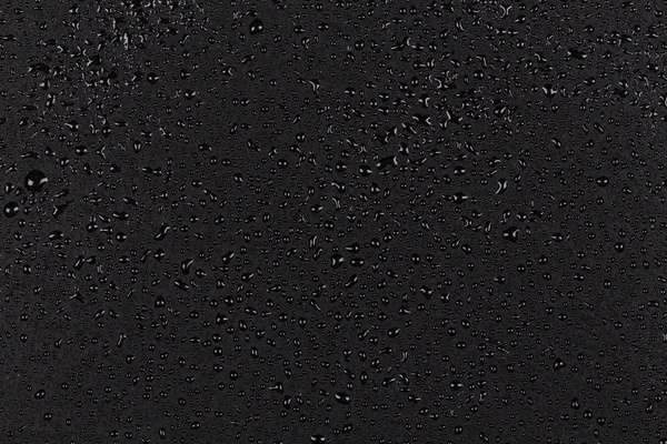 Air tetes pada batu hitam — Stok Foto