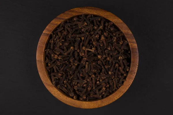 Clove spice in wooden bowl — Stock Photo, Image