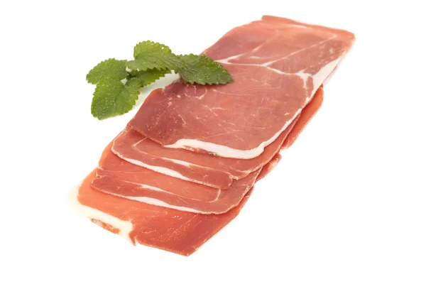 Closeup on a piece of spanish serrano ham — Stock Photo, Image