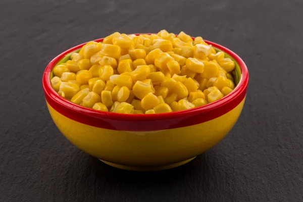 Sweet canned corn in bowl — Stock Photo, Image