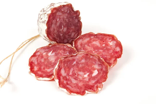 Pila de salami rojo, sobre un blanco — Foto de Stock