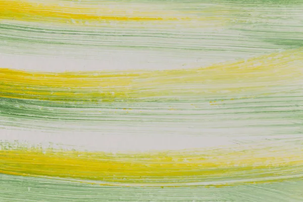 Зелено-жовті штрихи пензля — стокове фото