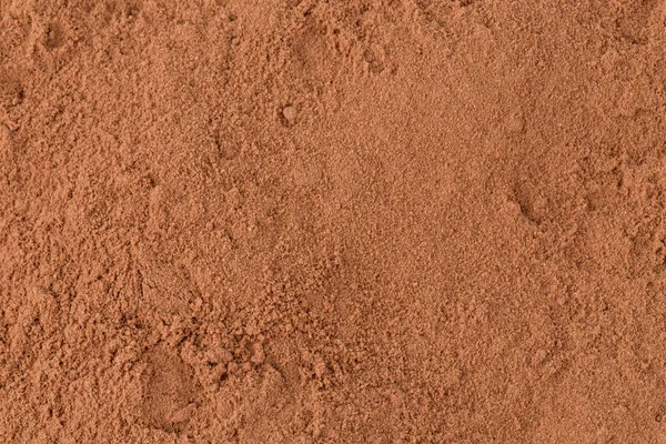 Cacao en polvo primer plano fondo —  Fotos de Stock