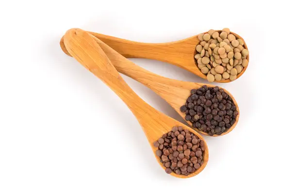 Lentils in spoon isolated — Stock Photo, Image