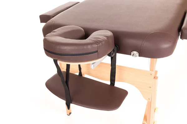 Massage Table from leather and wood isolated on a white background