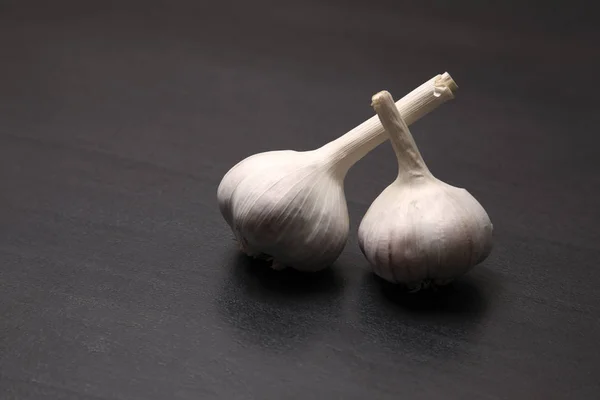 Garlic Isolated on black background, close-up.