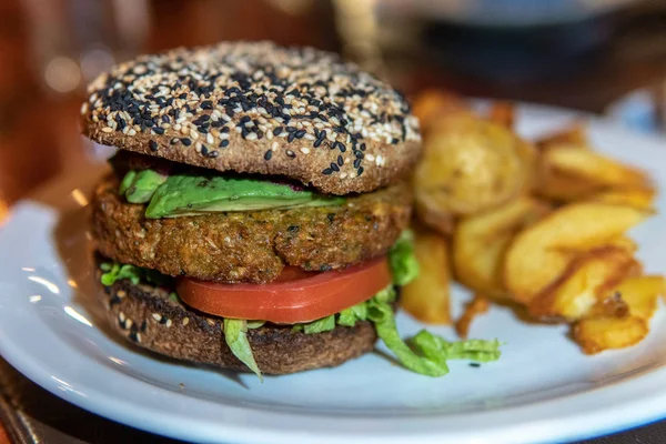 Veggie burger with tomatoes and fried