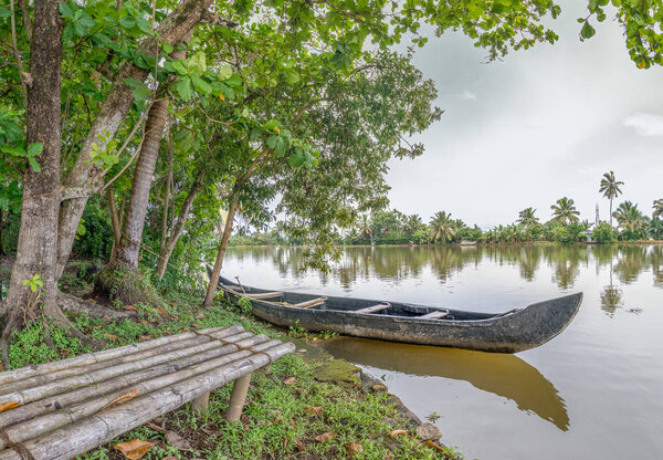 Boat and Bench on Island in Kerala Backwaters