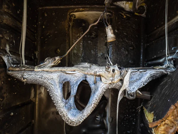 Melted plastic after a fire in the house. Old burned-out refrigerator. Danger to life