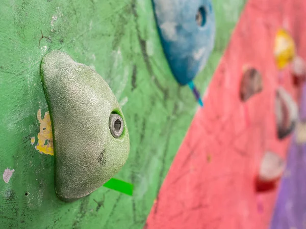 Strong hooks on the wall of the climbing wall. Training for climbers. Wall for climbers. Extreme sport
