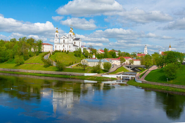 Vitebsk,Belarus - 14 May, 2020: Holy Assumption Cathedral of the Assumption on the hill and the Holy Spirit convent and Western Dvina River