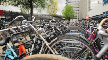 Close-up, a lot of bicycles in a parking lot near the central station of Amsterdam. Environmental conservation concept