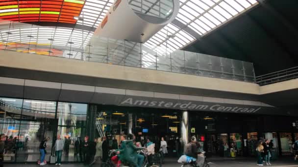 AMSTERDAM, Netherlands - October 2019: Amsterdam Central Station Terminal Entrance. — Stock Video