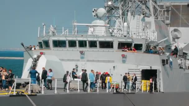 Odessa, Ukraine - September 2019: Civilians visiting a warship of NATO. In the frame of the gun and navigation equipment — ストック動画