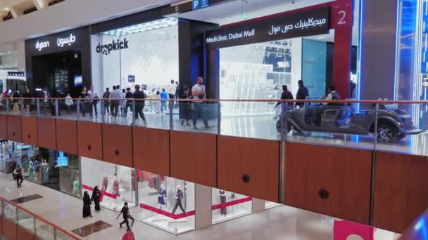 UAE, Dubai - February, 2020: Electric taxi car inside the worlds largest shopping mall Dubai Mall. The concept of luxury shopping. — Stok video