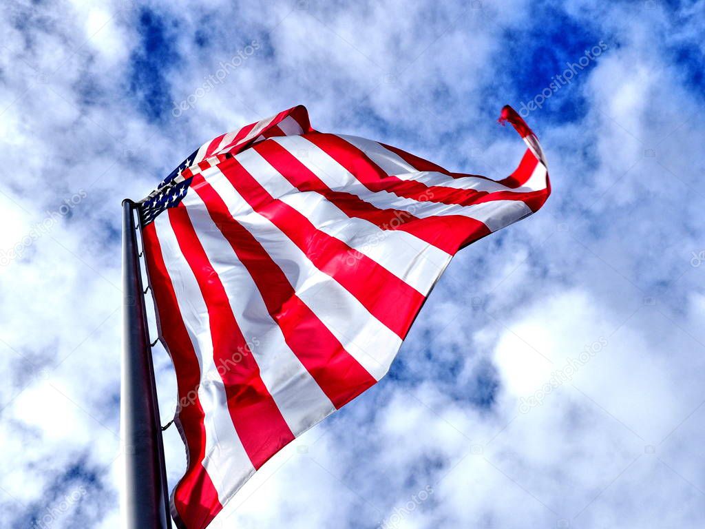 United States of America Waving Flag with Cloudy Sky Background