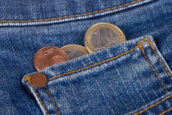 Monedas en euros en el bolsillo —  Fotos de Stock