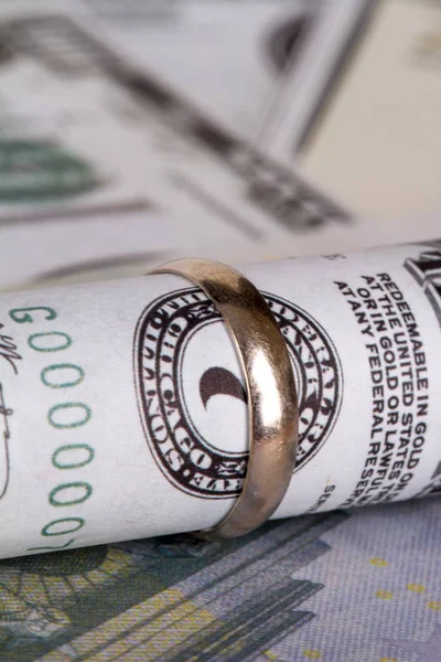 Banknotes with Marriage Ring in Finance Concept — Stock Photo, Image