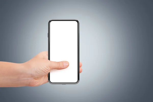 3Dレンダリング 白の空白の画面テンプレートと新世代のフルスクリーンスマートフォンのシングルモックアップイメージ 手を保持 — ストック写真