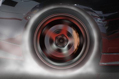 Sport car burning rear tire to heat up rubber for good traction before start to race. clipart