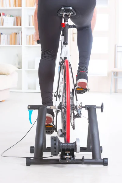 Man on bicycle trainer — Stock Photo, Image