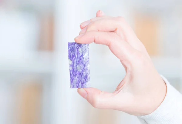 Real charoite in hand — Stock Photo, Image