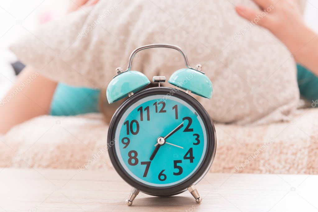 Alarm clock close to bed