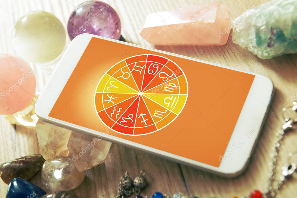 Modern astrology concept with mobile