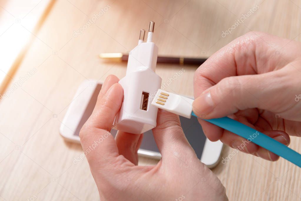 White charger with USB cable 