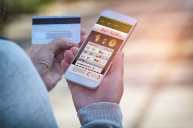 Adam akıllı telefon ile spor bahisleri