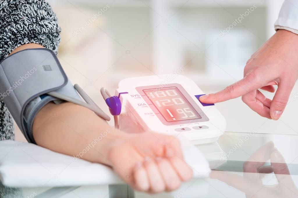 Doctor measuring blood pressure 
