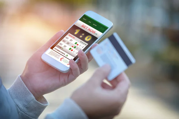 Vadslagning på sport med smartphone — Stockfoto