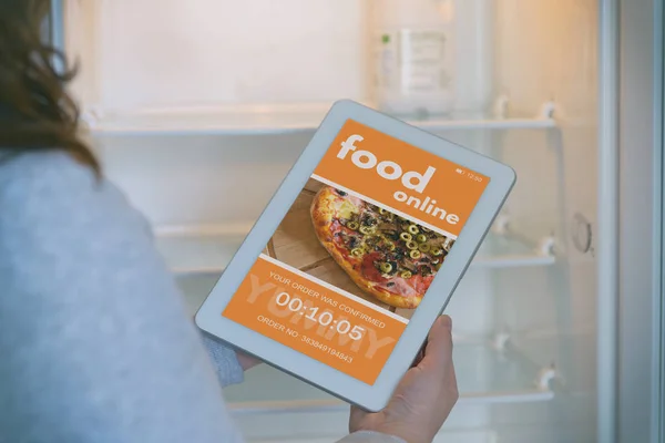 Ordering food online with tablet at home